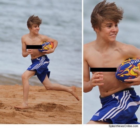 http://pics.blameitonthevoices.com/062010/justin_bieber_at_the_beach.jpg